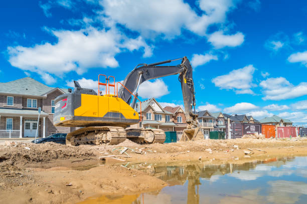 Excavator in a new residential district under construction Backhoe