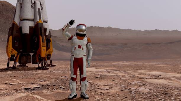 istock Astronaut waving his hand. Exploring Mission To Mars. Futuristic Colonization and Space Exploration Concept. 3d rendering. Colony on Mars. Elements of this video furnished by NASA. 1242158643