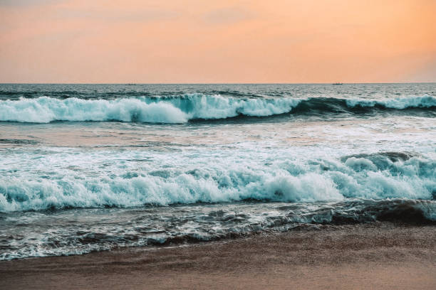 istock Big waves during a sunset in Hikkaduwa, Sri Lanka. 1242181540