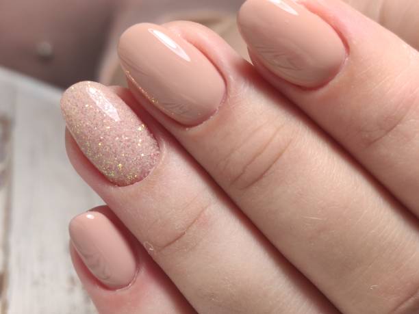 istock sexy pink manicure on long beautiful nails 1242182635