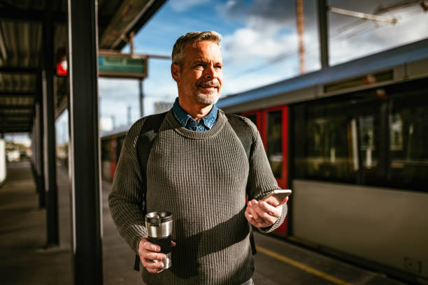 istock Mature gray hair man commuting by commuter train or subway 1242183731