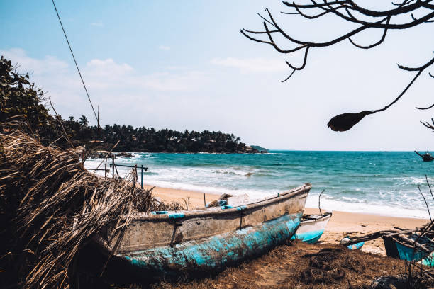 istock Abandoned old fishing boat on the beach 1242184312
