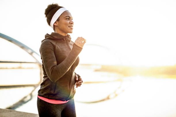 istock Athletic Woman Running Outdoors 1242185364
