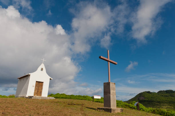 istock Chapel and Cross in a beautiful sky 1242186983