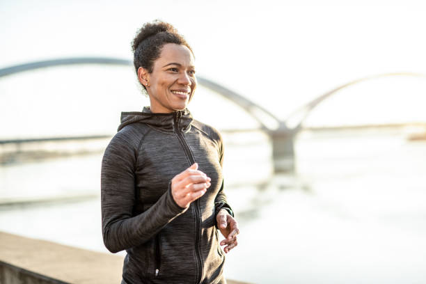 istock Athletic Woman Running Outdoors 1242187500