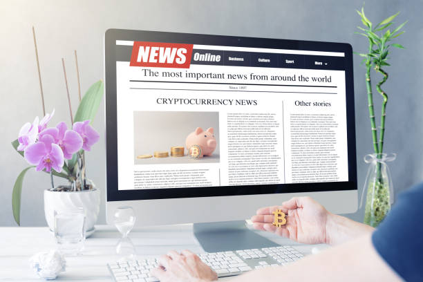 istock Men reading cryptocurrency news on a computer screen. Mockup website. Newspaper and portal on internet 1242196121