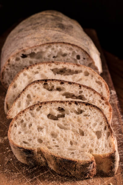 istock Sliced Panini bread on a wooden board in window light 1242196634