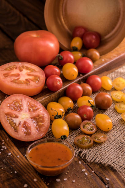 istock tomatoes spreading out on a wooden board 1242202066