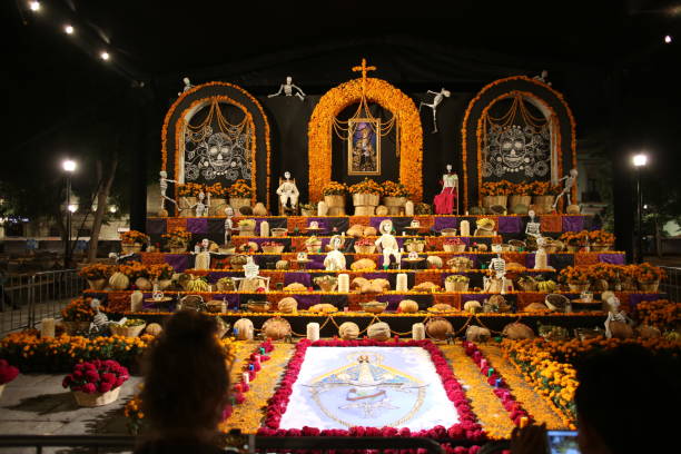 Day of the Dead altar in Mexico. Oaxaca, Mexico - October 31, 2018: A night shot of a traditional shrine to celebrate Dia de los Muertos religious offering stock pictures, royalty-free photos & images