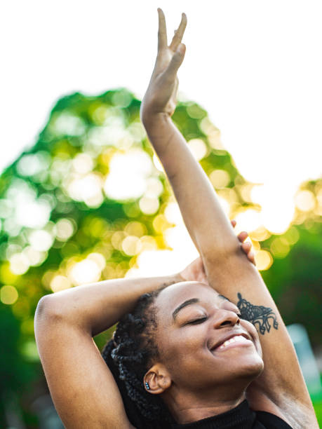 istock Dancing African woman in the park 1242219154