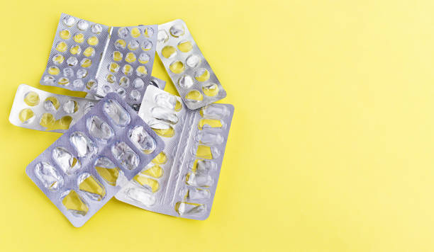 istock Empty blister packs from tablets on a yellow background. The packaging of the tablets. Copyspase 1242221282