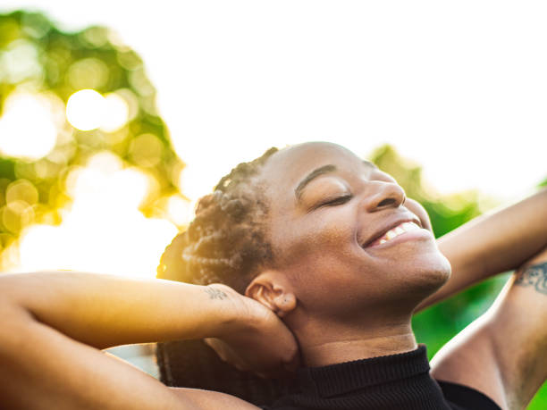 istock Dancing African woman in the park 1242228292