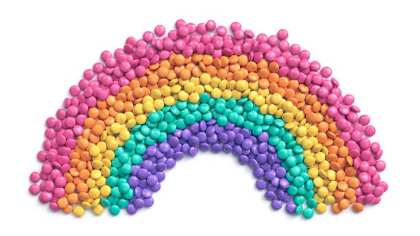 istock Colorful coated chocolate candies arranged as rainbow on white background 1242259661