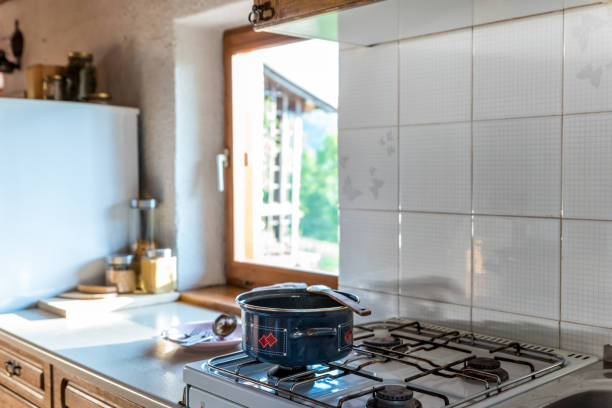 istock Cooking on a Gas Stove in Rustic Kitchen 1242259703