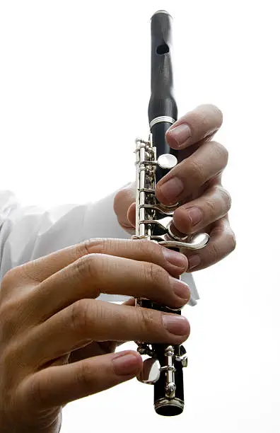 Musician holding his piccolo.