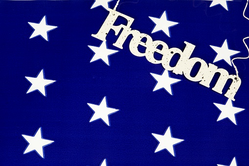 Blue star fabric with metal freedom sign.