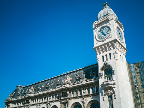 Front view of a french city hall with french and european flags and the national motto of France \