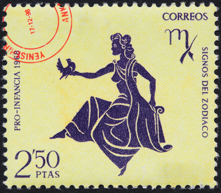 Extreme macro shot of a zodiac sign stamp, Virgo, from  1968