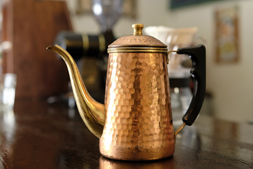 Copper coffee pot.