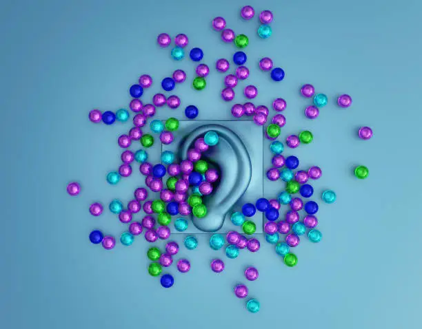 Multicolored orbeez balls scattered on a ASMR microphone. Autonomous Sensory Meridian Response. Relaxing sound concept. 3d illustration