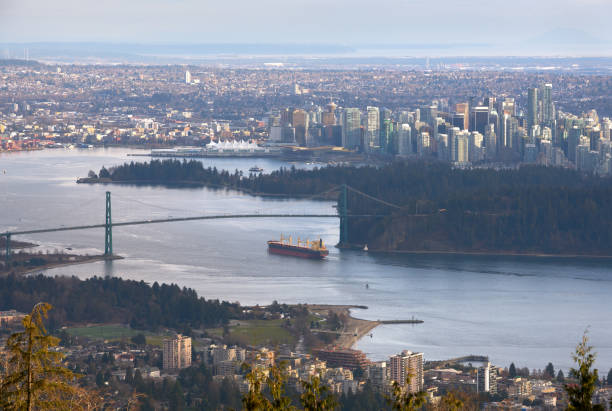 istock Vancouver Burrard Inlet Freighter and Cityscape 1242415369
