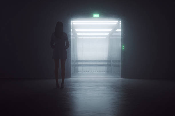 istock Woman standing in front of elevator at night 1242448611