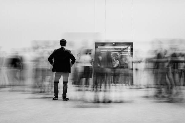 istock Office building lobby with business people in motion 1242453298