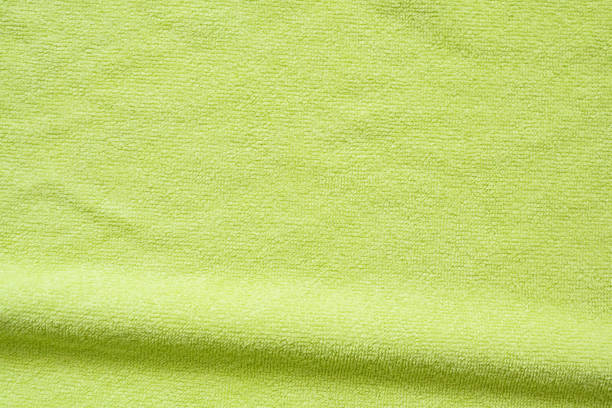 istock Green towel fabric texture surface close up background 1242453879