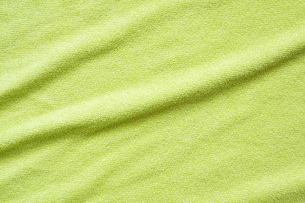istock Green towel fabric texture surface close up background 1242453881