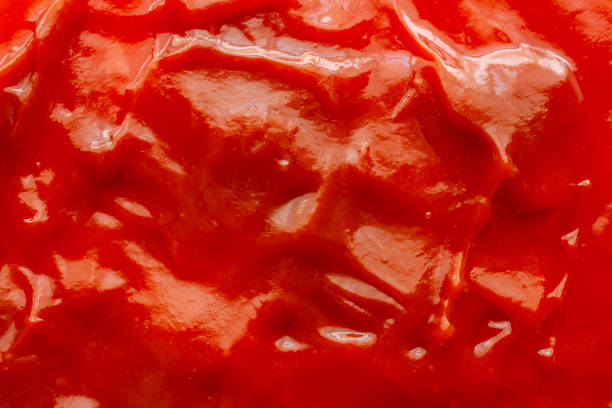 istock Tomato sauce ketchup texture background close up 1242453883
