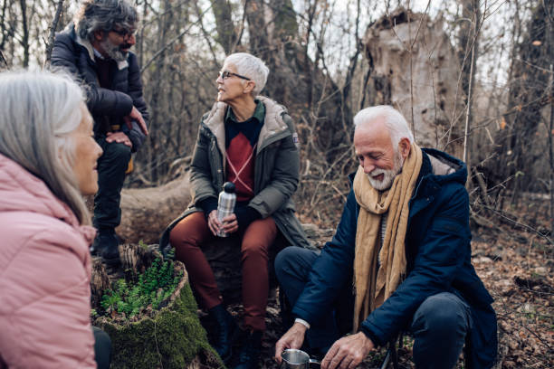 istock Seniors making coffee and resting during hiking 1242458649