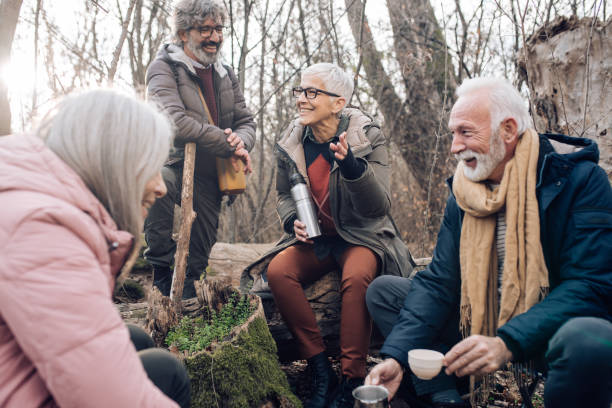 istock Seniors taking a break for coffee during their hiking adventure 1242458655