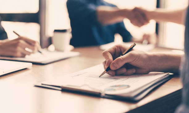 istock close up. business colleagues work with financial documents 1242478053