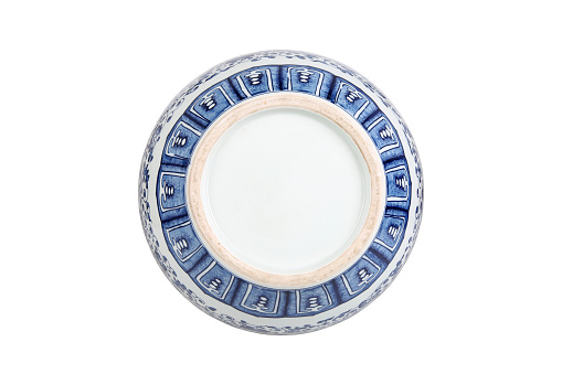 Decorative blue and white porcelain plate on white background