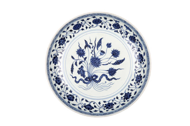 istock Decorative blue and white porcelain plate on white background 1242498859