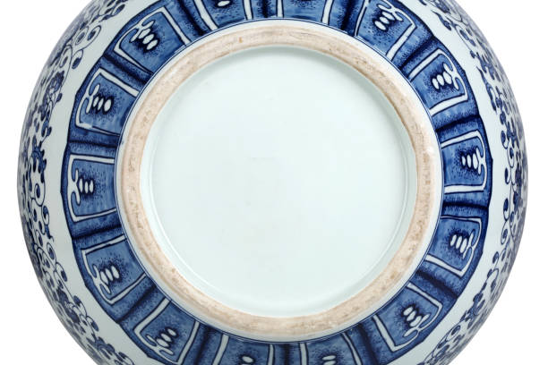 istock Decorative blue and white porcelain plate on white background 1242498868