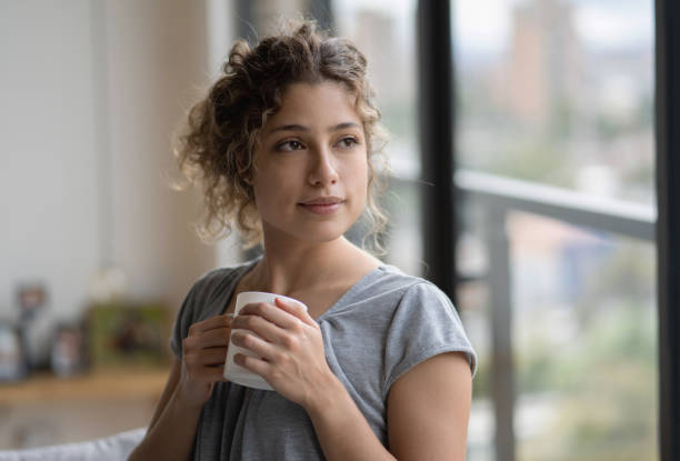 istock Woman at home during the quarantine drinking tea 1242508929