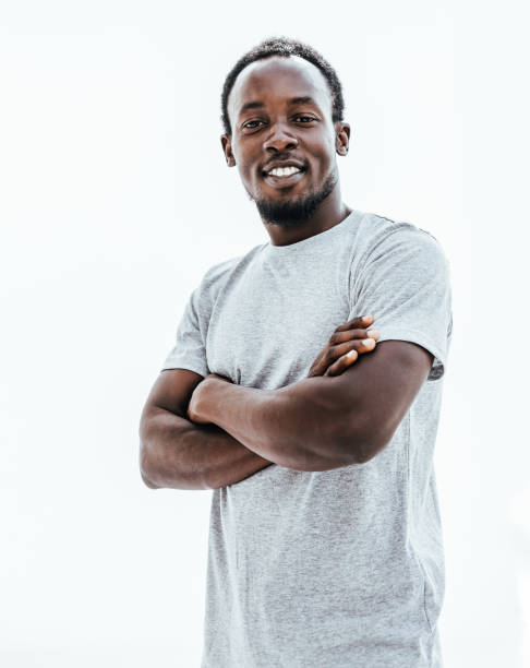 istock confident young man in a white t-shirt. isolated on white 1242512688