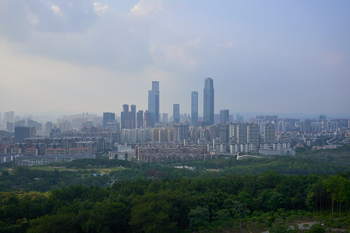 City view in Nanning, Guangxi province China from high level with sunny lights. Green city space view.