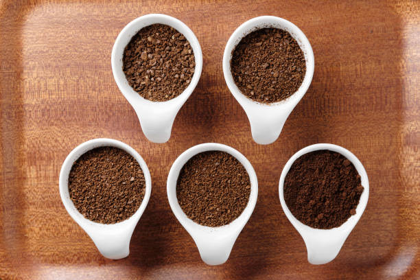Five levels of ground coffee beans. Five levels of ground coffee beans. grinding stock pictures, royalty-free photos & images