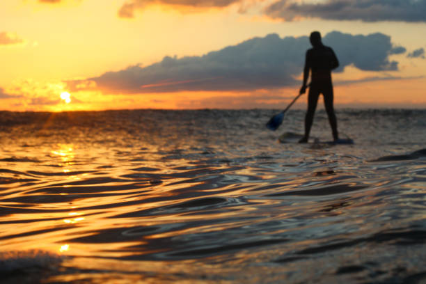 istock Stand Up Paddle Boarding In Japan During a sunrise and sunset after a typhoon 1242554643