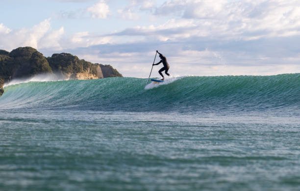 istock Stand Up Paddle Boarding In Japan During a sunrise and sunset after a typhoon 1242554644