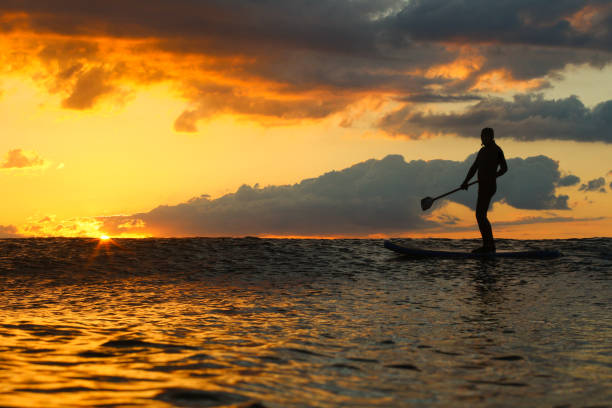 istock Stand Up Paddle Boarding In Japan During a sunrise and sunset after a typhoon 1242554647