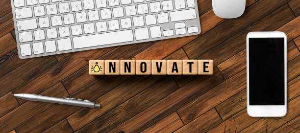 istock cubes with message INNOVATE and office equipment 1242565143