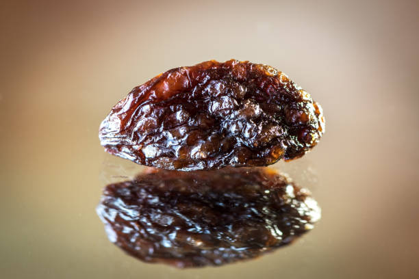 Raisins with reflection. extreme closeup showing detailed texture