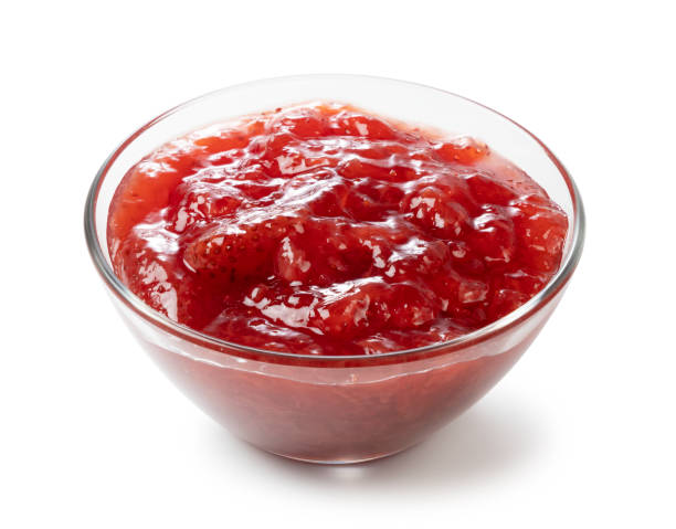 istock strawberry jam in a glass bowl on a white background 1242603472