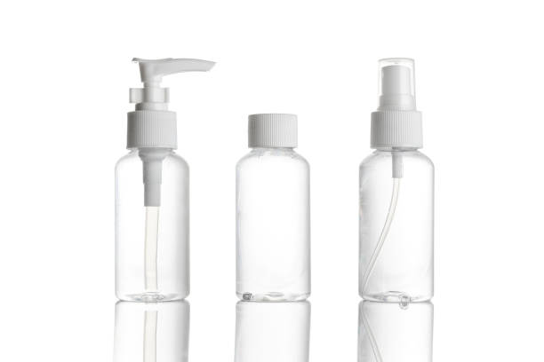 istock Sanitizer bottle. Empty clear plastic pump container for antiseptic gel, cosmetic soap and mineral shampoo isolated on white. Water cap blank spray on transparent background. 1242642796
