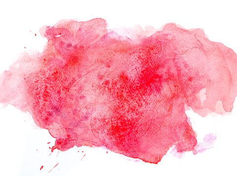 Red watercolor splatter with splashes on white watercolor paper