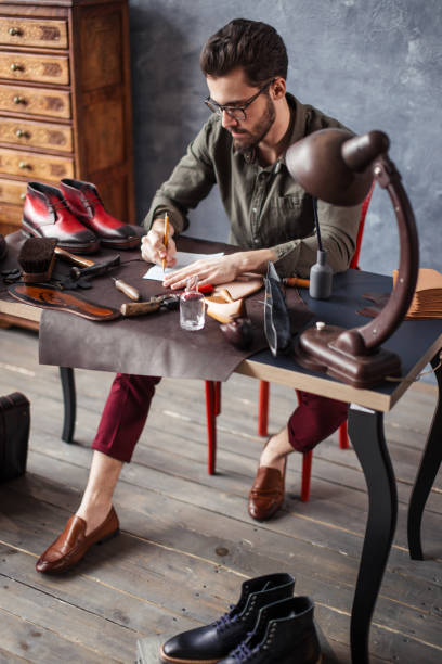 istock young talented man conceptualizing and developing own footwear design 1242740890