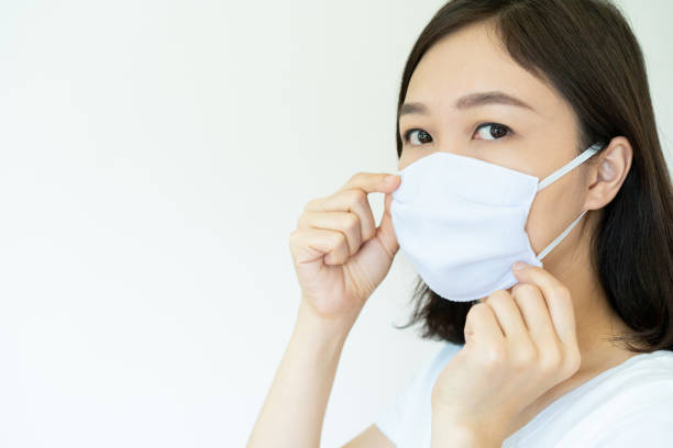 istock Woman wearing protective mask 1242741313